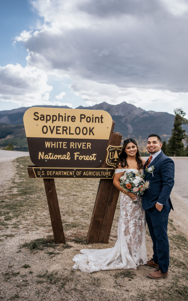 married couple posing in wedding clothes at sapphire point